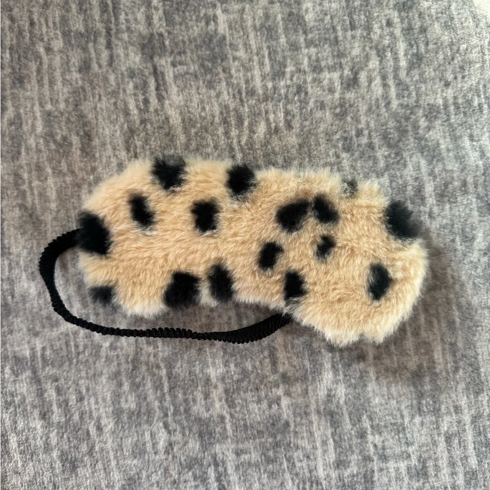 Fuzzy black and cream sleep mask